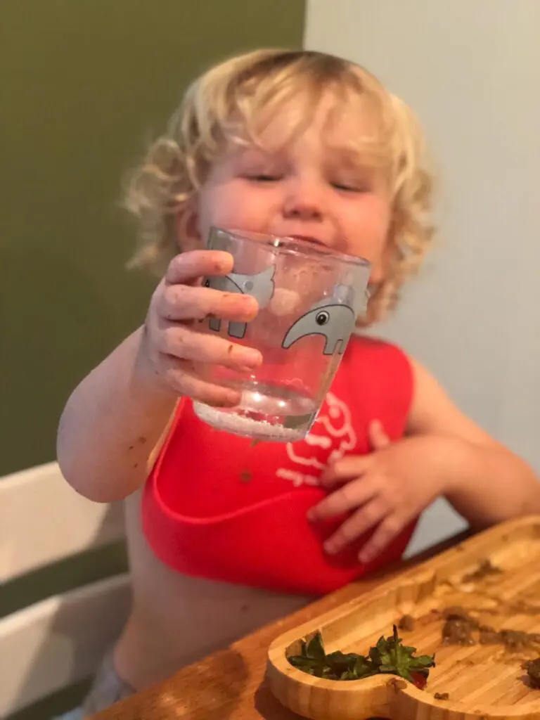 How to help your baby drink from an open cup or straw